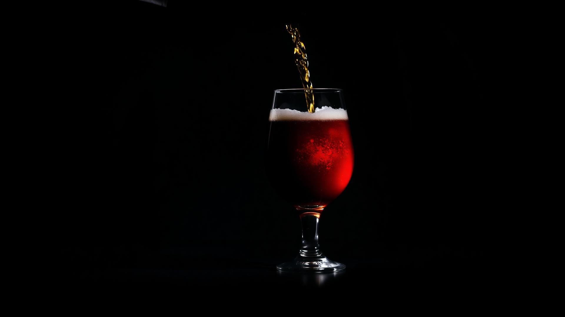 Craft beer being poured into a pint glass